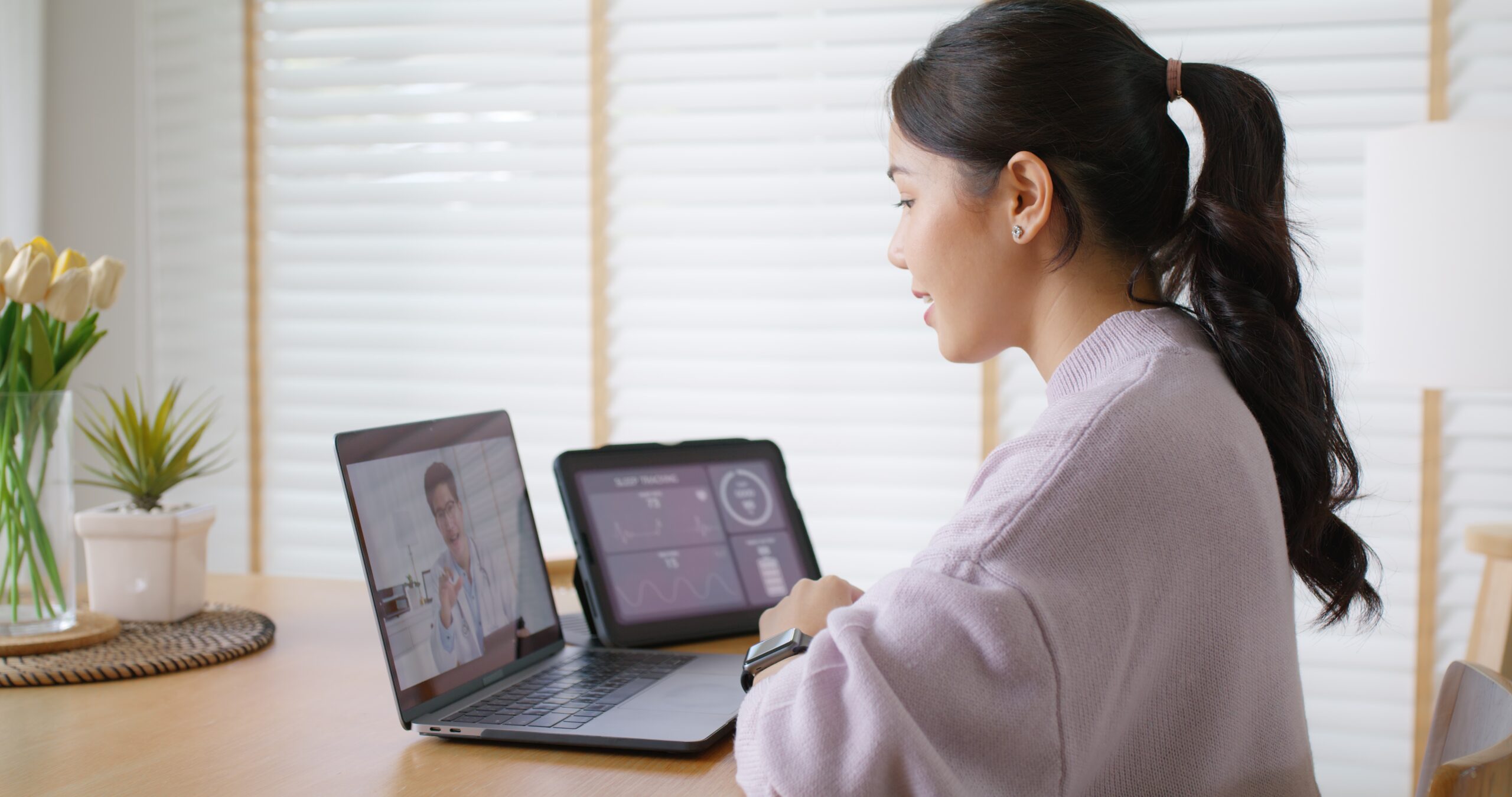 young asian woman on video appointment