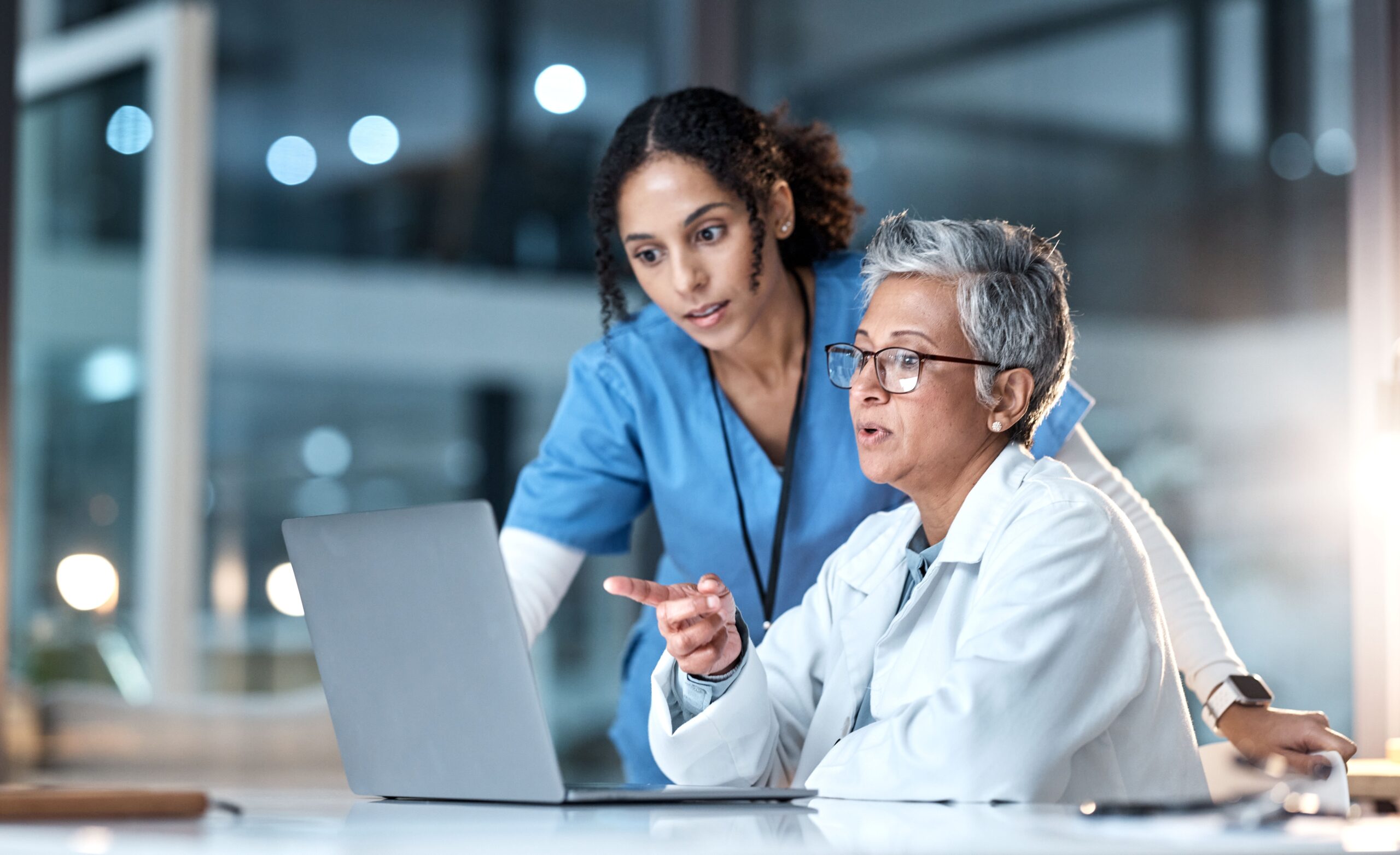 doctor and nurse on laptop planning
