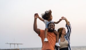 portrait of happy young black family smiling